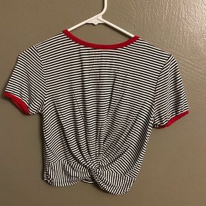 Two woman’s tied up cropped tops